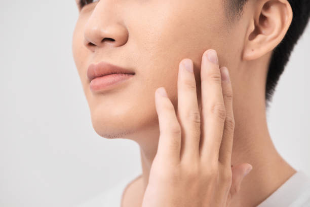 istock Men Face Care. Man Touching Smooth Skin After Shaving 1279278500