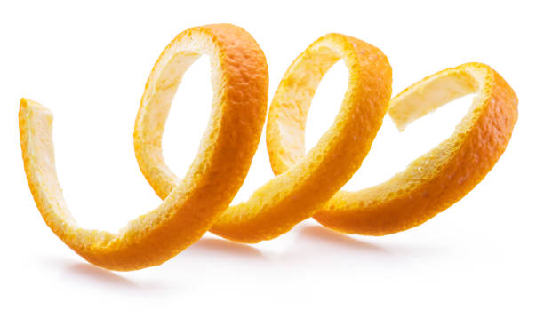 Orange peel or orange twist on white background. Close-up.