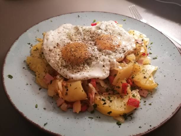 istock Homemade fried potatoes with fried eggs 1279279439