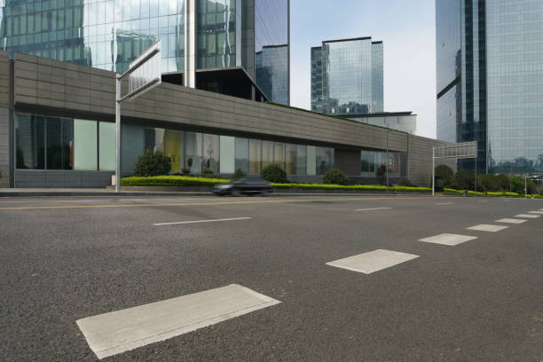 istock empty asphalt road in front of modern office buildings. 1279280830