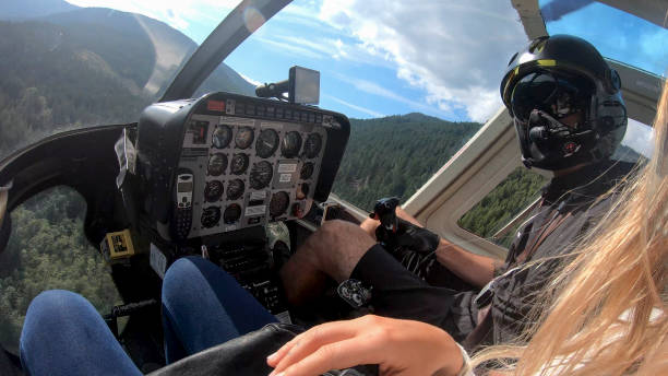 istock View past young woman to pilot flying helicopter 1279282901