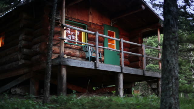 Log cabin at dusk