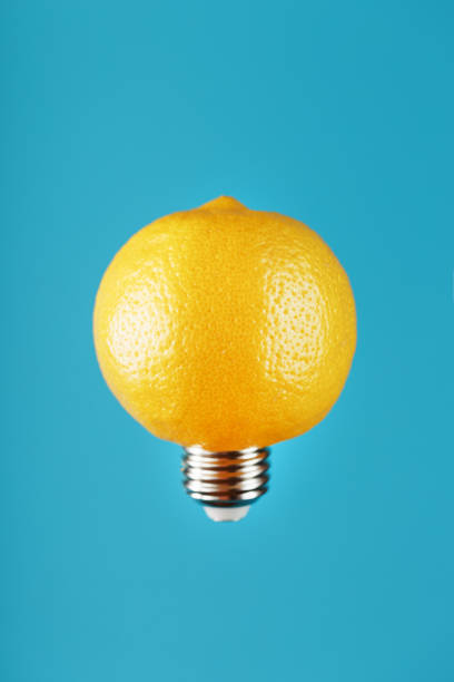 istock Light bulb lemon in flight on a blue background. The conceptual idea. 1279287087