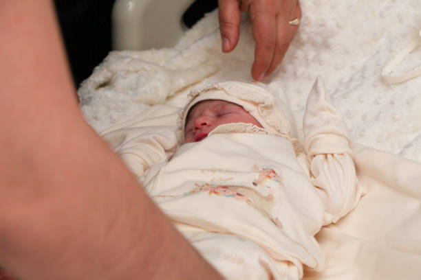 istock Newborn baby in hospital taking injection 1279288829