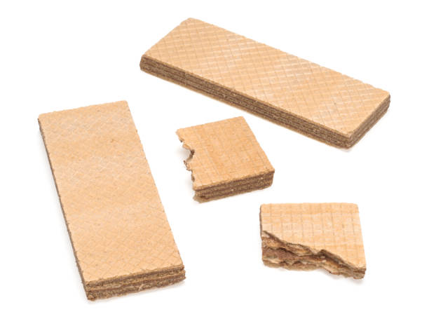 istock Two waffles and two pieces of waffles on white background 1279290296