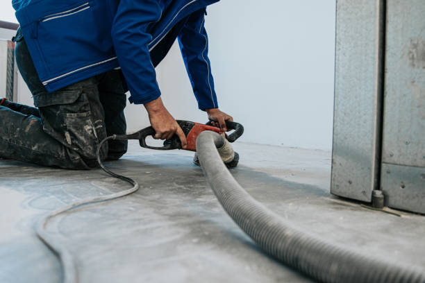 istock Construction worker using machine polishing surface floor smoothing and finishing hardener or epoxy concrete in the factory. 1279290312