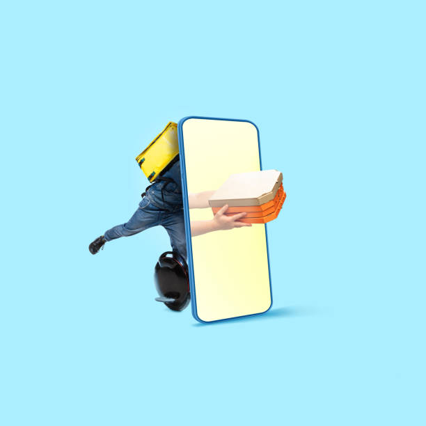 istock Handsome delivery man giving order right from smartphone's screen, fast delivery concept 1279290518