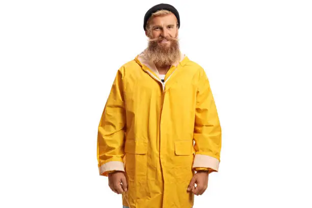Bearded fisherman with a yellow rain coat smiling isolated on white background