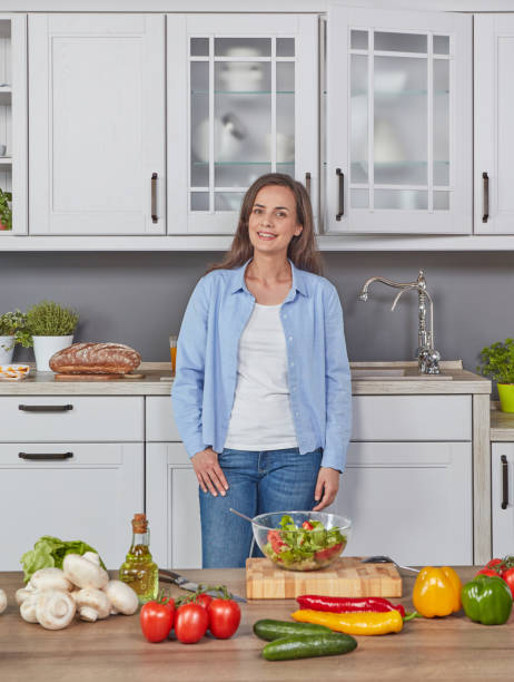 istock Cheerful woman in the kitchen 1279293260