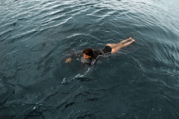 istock High angle view of woman floating on the water 1279293729