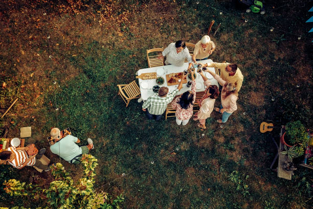 istock Happy friends celebrating with drinks at backyard 1279295286