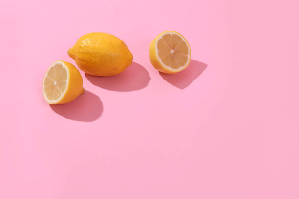 istock Trendy yellow lemon isometric pattern on pink background. Creative modern minimal concept. Summer fresh flat lay food texture, copy space. 1279296292