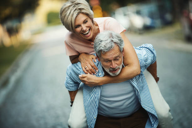istock Middle aged couple having fun outdoors. 1279296450