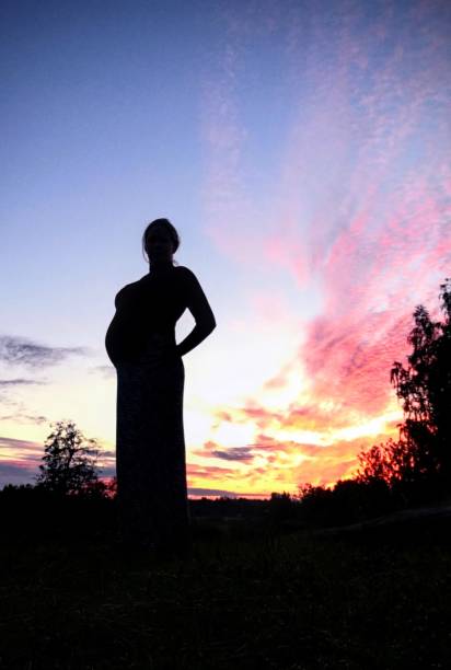 istock Proud pregnant woman in sunset 1279297631