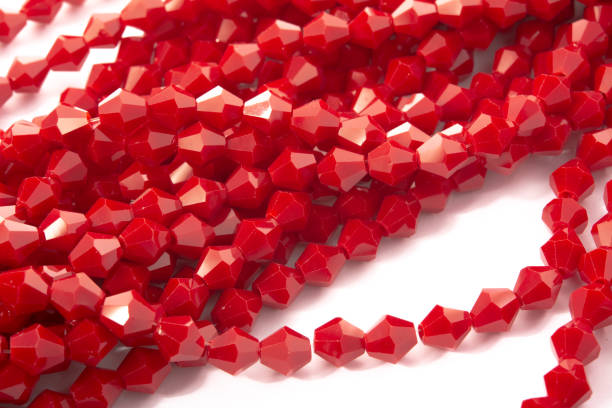 istock Beautiful Red Glass Sparkle Crystal Isoalted Beads on white background 1279297864