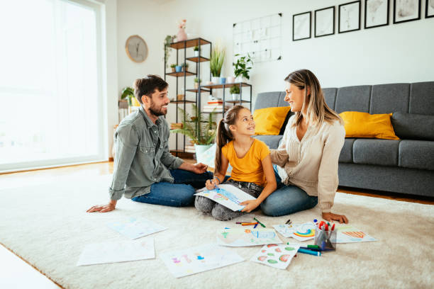 istock Family at home drawing with daughter 1279298431