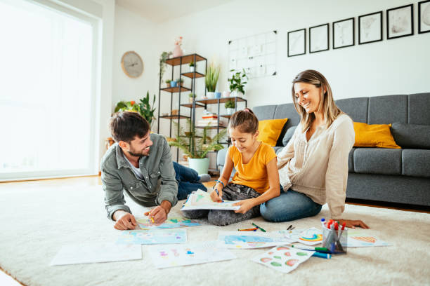 istock Family at home drawing with daughter 1279298491