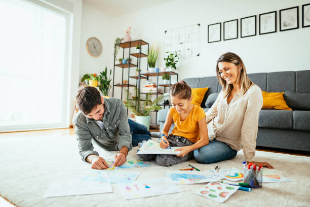 istock Family at home drawing with daughter 1279298565