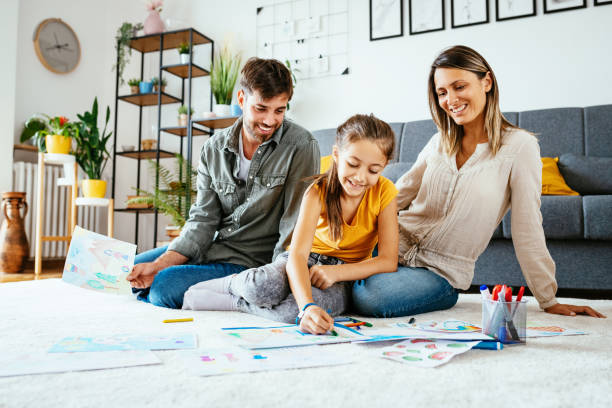 istock Family at home drawing with daughter 1279299094