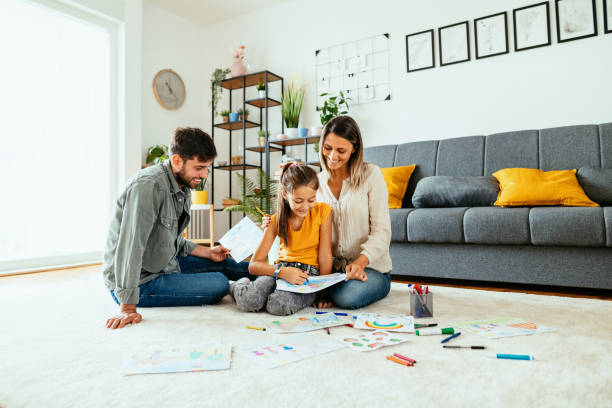 istock Family at home drawing with daughter 1279299204