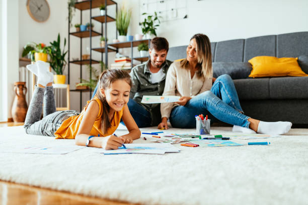 istock Family at home drawing with daughter 1279299205
