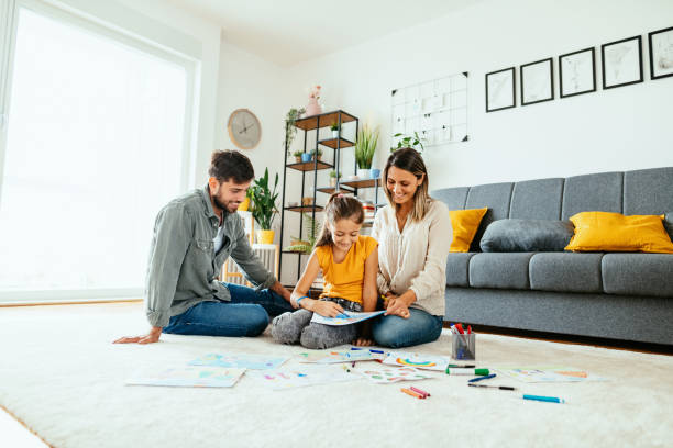 istock Family at home drawing with daughter 1279299207