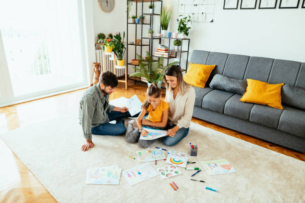 istock Family at home drawing with daughter 1279299282