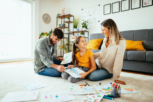 istock Family at home drawing with daughter 1279299283
