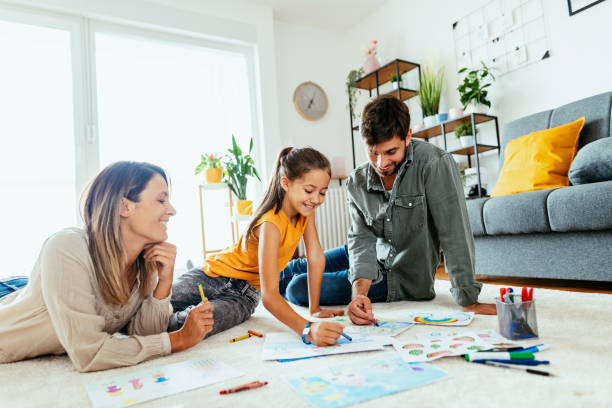 istock Family at home drawing with daughter 1279299340