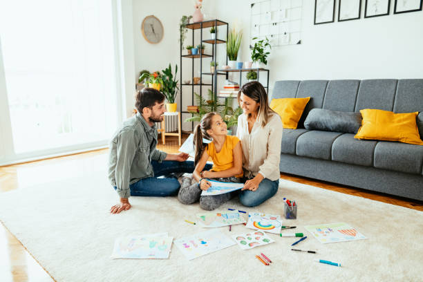 istock Family at home drawing with daughter 1279299376