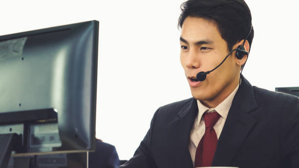istock Business people wearing headset working in office 1279300872