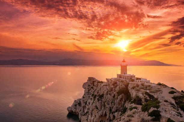 beautiful sunset in the lighthouse in melagavi cape at loutraki, greece. - gulf of corinth imagens e fotografias de stock