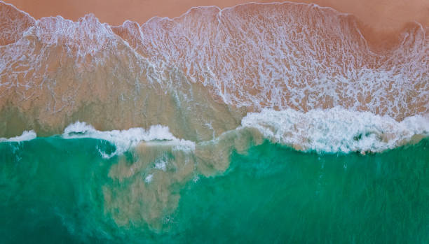 istock Aerial of waves on the beach 1279301422