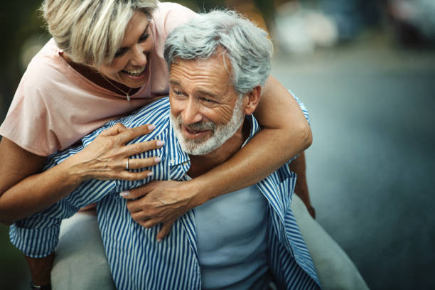 istock Middle aged couple having fun outdoors. 1279304120