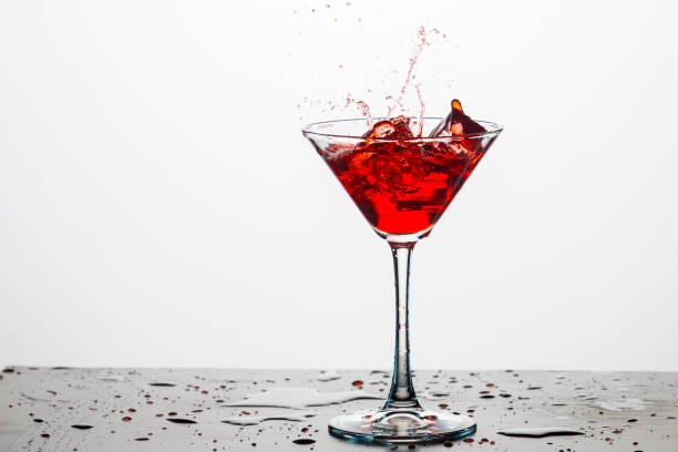 istock Action Splash Photography. Red Wine Glass With Splashes Against White Background. Vertical Image 1279305185