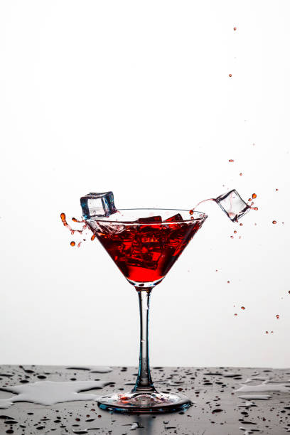 istock Action Splash Photography. Red Wine Glass With Splashes Against White Background. Vertical Image 1279305206