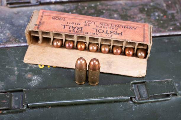 istock Pistol ball caliber .45 M1911 box with cartridges 1279305270