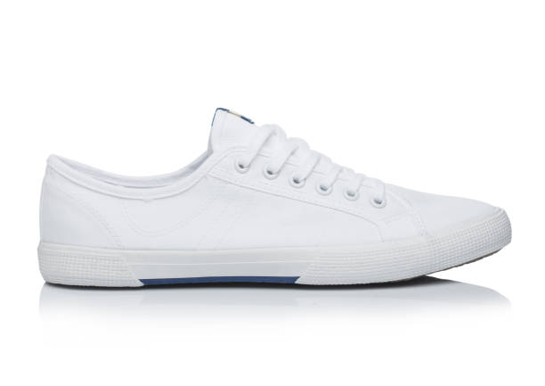 istock White jeans fabric man sneakers shoes on white with reflection 1279306762