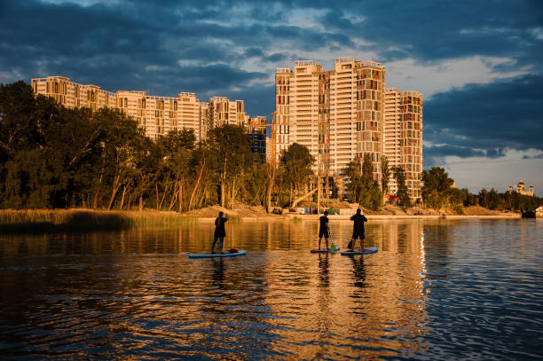 istock group of people floating on sup boards on the river 1279307088