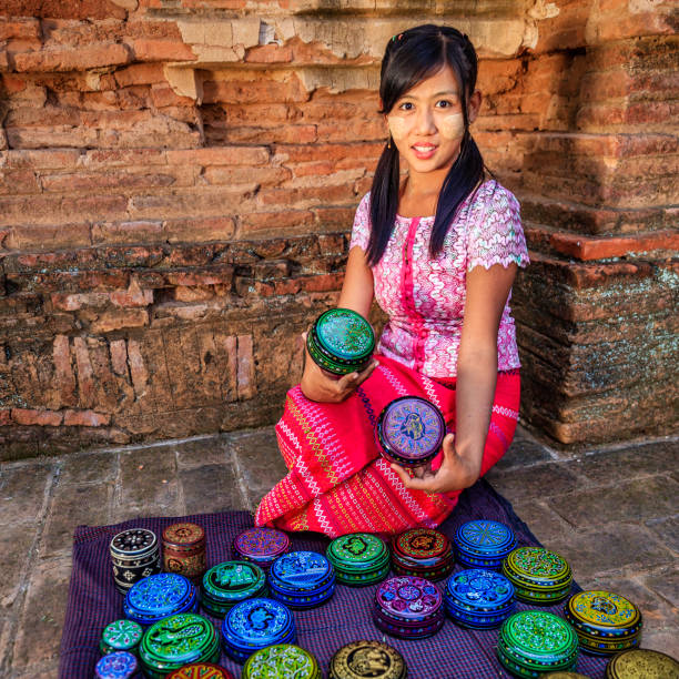 istock Young Burmese girl selling a lacquerware in Bagan, Myanmar 1279307472