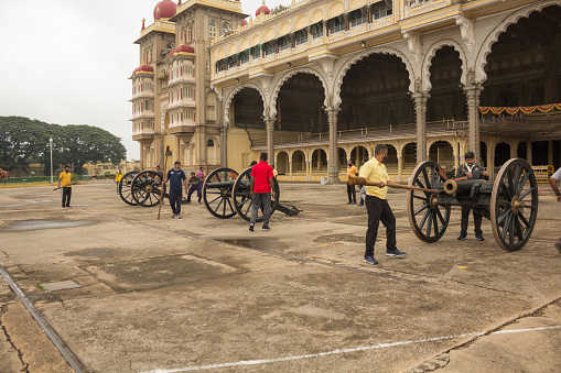 A Dramatic view of a Canon Drill being Rehearsed by the Royal Army personnel for the Dasara festival inside Ambavilas Palace in Mysuru of Karnataka/India.