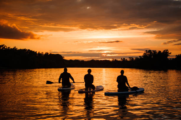 istock beautiful view on people floating on sup boards on the river 1279308579