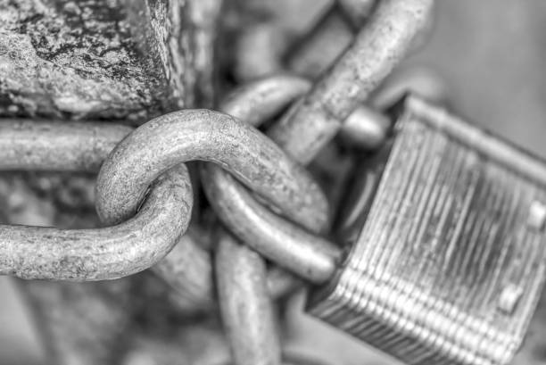 Padlocked & Chained A padlocked chain stopping entry padlock photos stock pictures, royalty-free photos & images