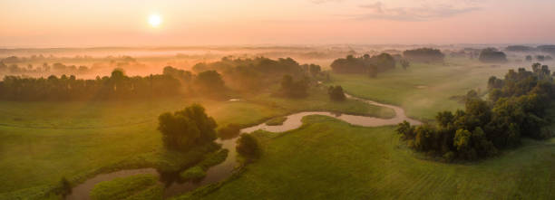 istock Sunrise over riparian forest with tortuous river meanders in summer 1279308948