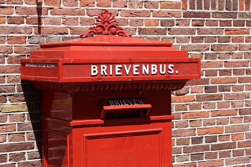 Historical post box in the Netherlands. Dutch national postal service PostNL employs more than 77,000 people.