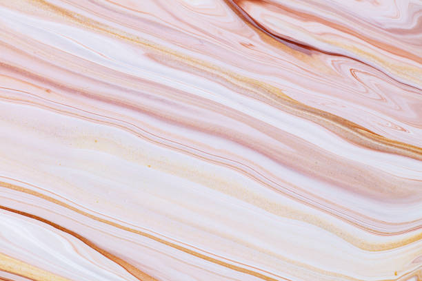 istock Fluid art texture. Background with abstract swirling paint effect. Liquid acrylic picture with flows and splashes. Mixed paints for posters or wallpapers. Golden, brown and beige overflowing colors. 1279310434