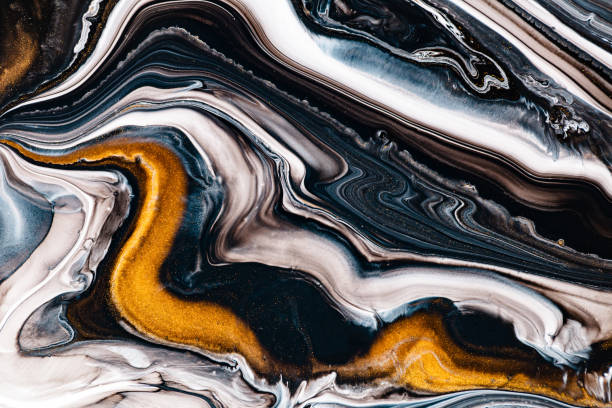 istock Fluid art texture. Abstract background with mixing paint effect. Liquid acrylic picture that flows and splashes. Mixed paints for posters or wallpapers. Golden, blue and brown overflowing colors. 1279310589