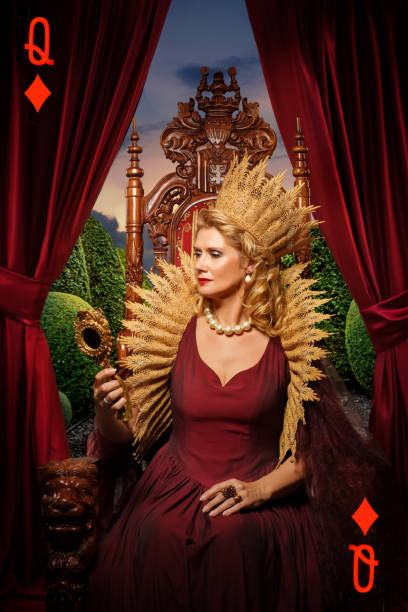 Queen of Hearts type character on the throne