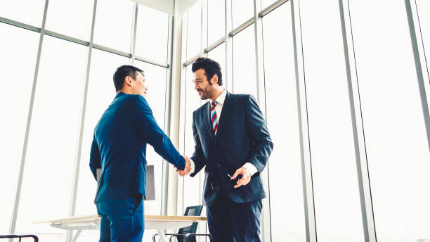 istock Business people handshake in corporate office 1279311473