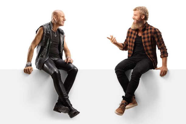 istock Punk and a bearded casual guy sitting on a blank panel and talking 1279313506